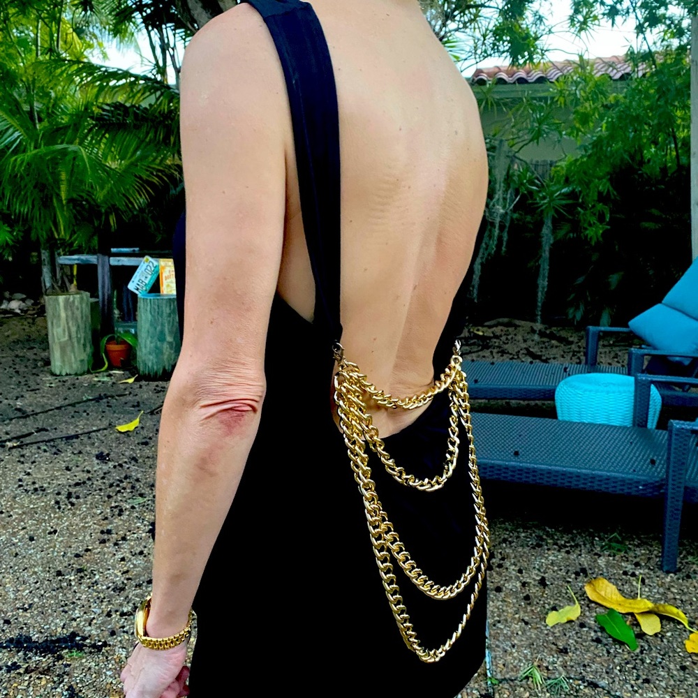 ASOS Jet black loose tank with gold chains on back.